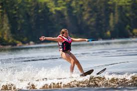 Water skier on a lake in Northwest Maine during a Petersen Waterskiing lesson