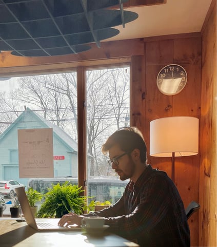 Coworking member testing workspace setup during a day pass at The Study